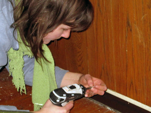 Installing a door sweep.