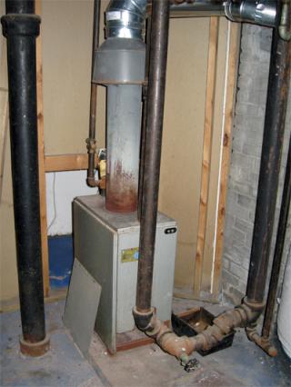 40+ year-old, 55% efficient boiler leaking significant amounts of Carbon Monoxide (CO2).